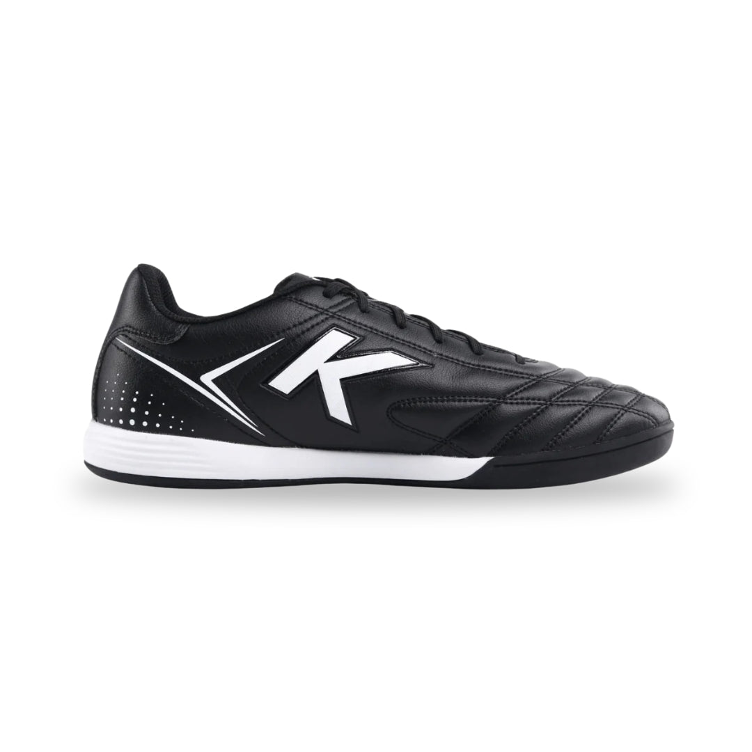 Black leather shoe with a circular buckle on a white background