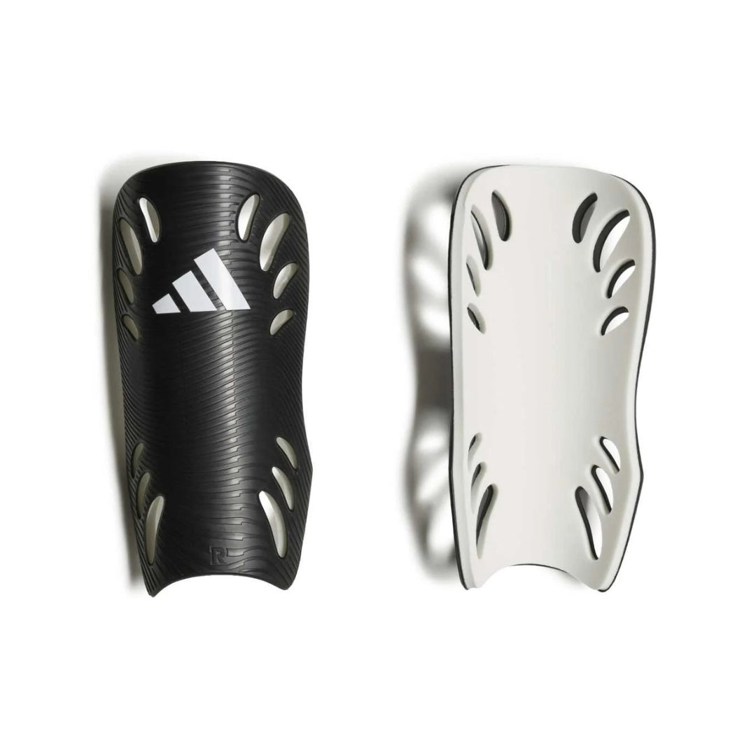 A pair of Adidas soccer shin guards shown side-by-side against a white background, one in textured black with a white Adidas logo, and the other in white with black trim.