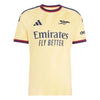 A pale yellow Arsenal home soccer jersey by Adidas, featuring the club's crest, the Emirates Fly Better sponsor logo, and navy blue and red trim on the collar and sleeve cuffs.