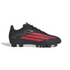 Black soccer cleat with red stripes on a white background