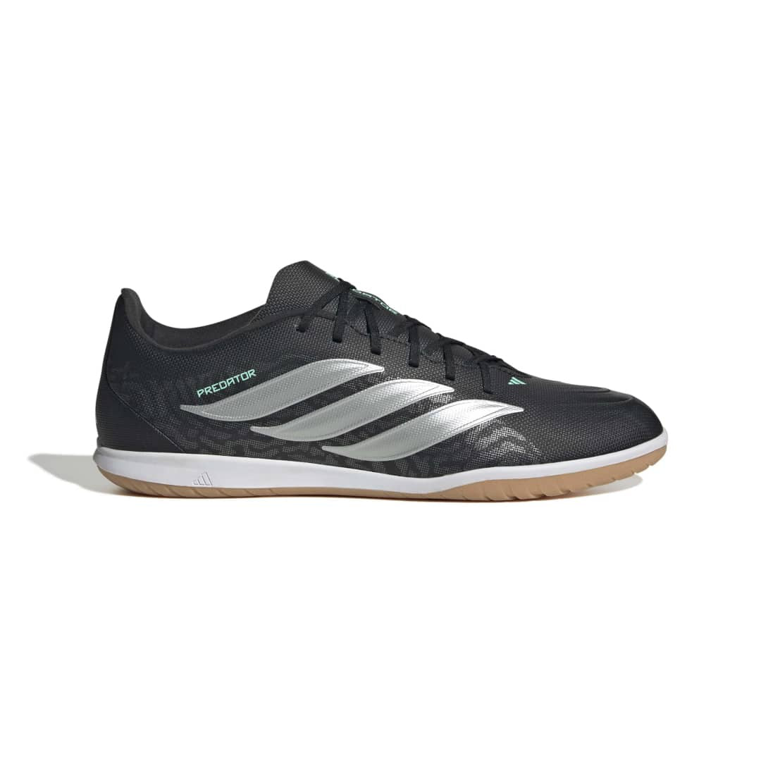 A dark gray and black Keen hiking shoe with green accents, shown in a side profile on a white background.