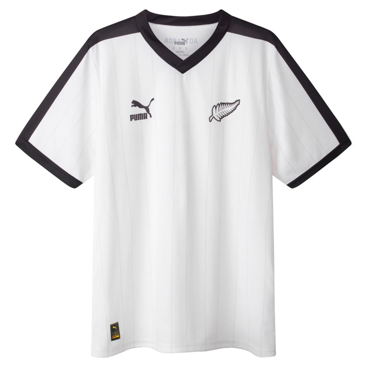 White sports jersey with black accents and Puma logo on a white background