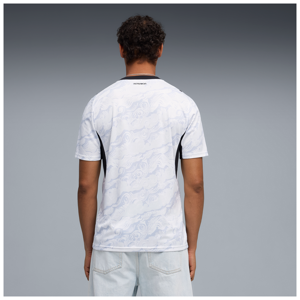 back of person wearing NZ All Whites Football Jersey