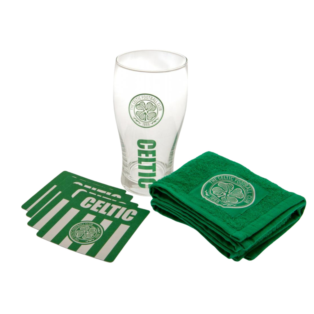 Celtic-themed bar set including a clear pint glass, four green coasters, and a folded green towel, all featuring the Celtic logo and wordmark on a white background.