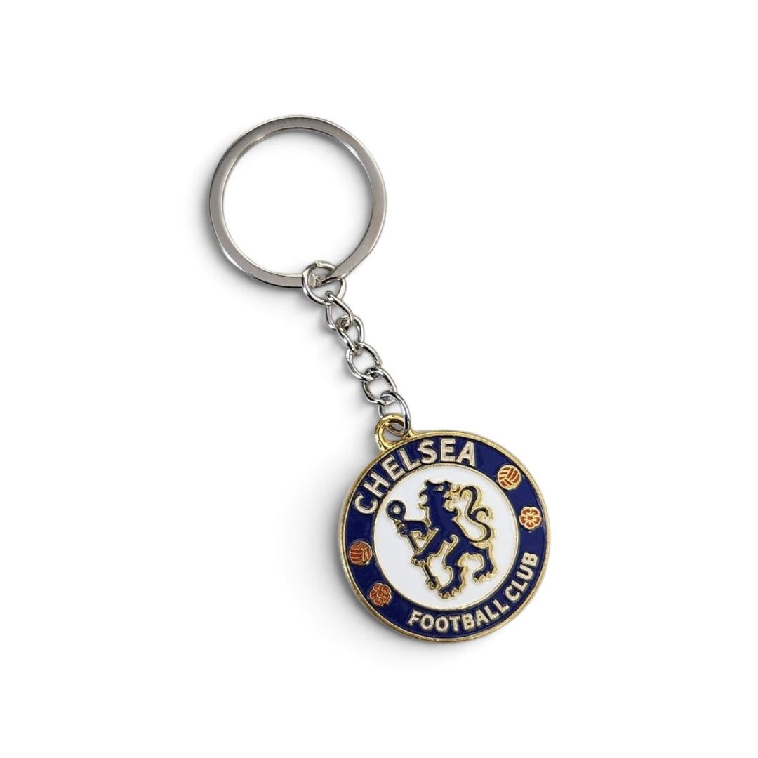 A Chelsea Football Club keychain featuring the club's lion crest in blue, gold, and white, attached to a silver metal split ring and chain, shown on a plain white background.