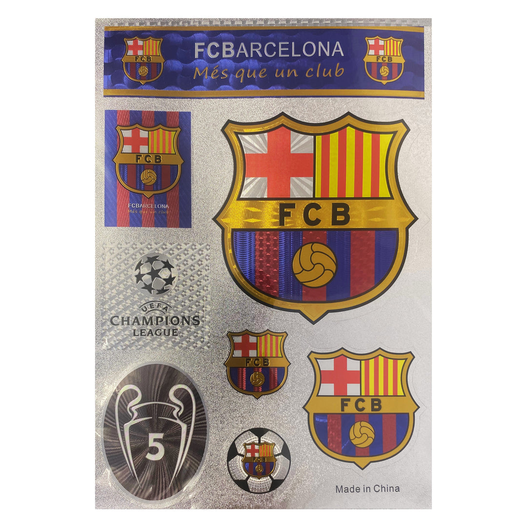 FC Barcelona 'Més que un club' commemorative sticker sheet featuring multiple team crest designs, a Champions League logo, and a Champions League Cup Final 2005 emblem on a silver backing card.