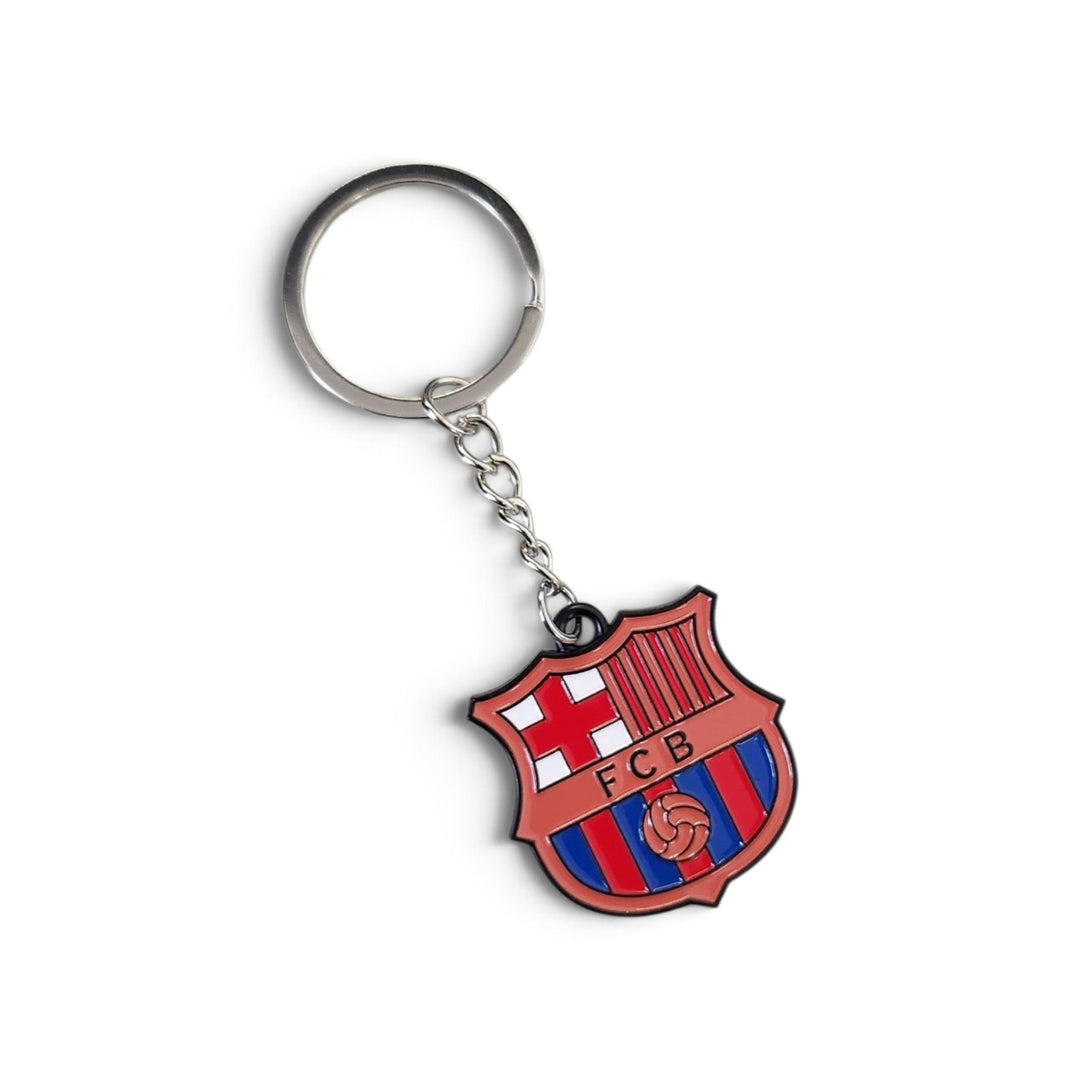 An FC Barcelona soccer keychain featuring the club's crest in red, blue, and white enamel, attached to a silver metal key ring and chain, shown on a plain white background.