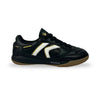 A black leather indoor soccer shoe with a white and gold side stripe, black laces, and a brown gum sole, shown against a plain white background.