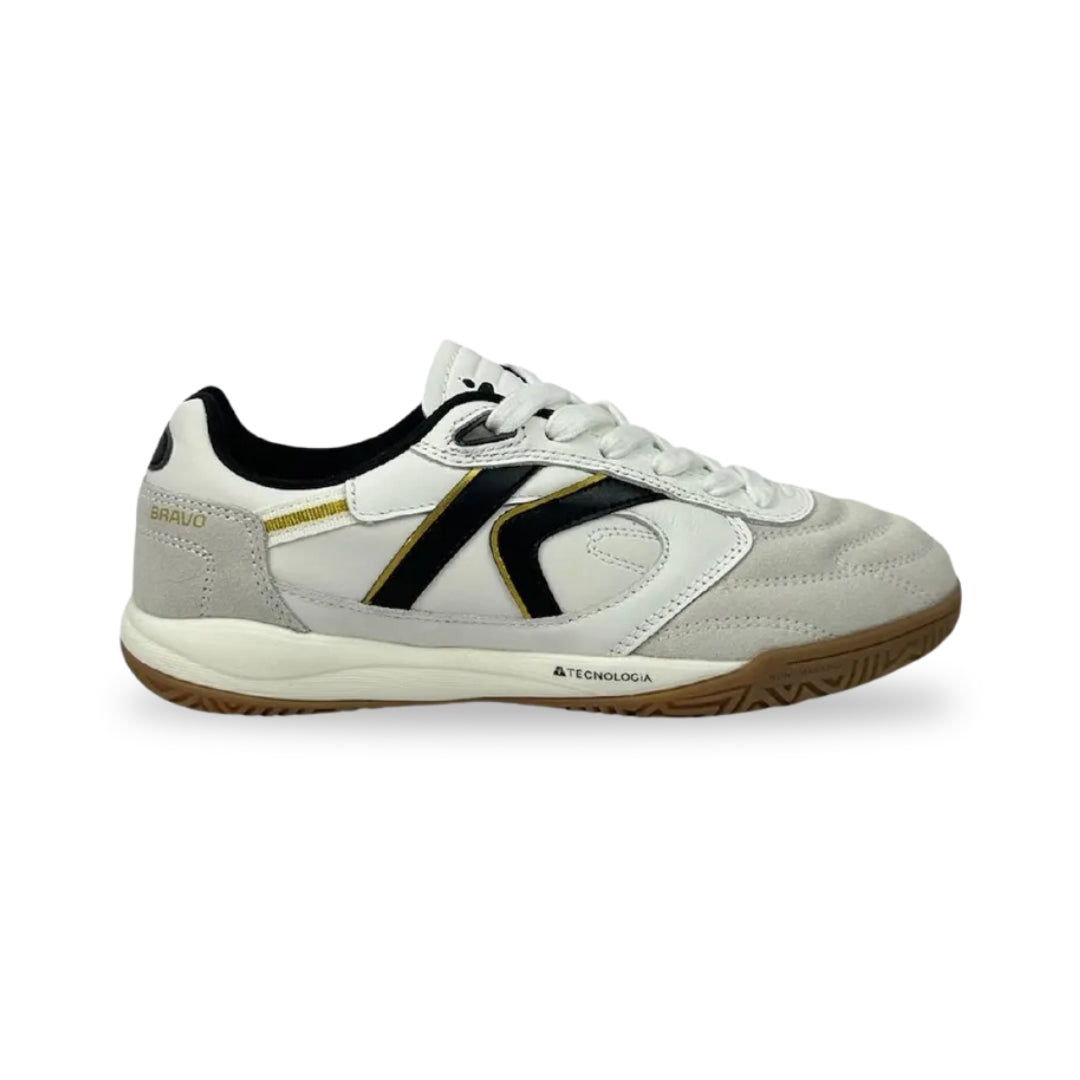 A white low-top athletic shoe with black and gold accents, featuring a white laces and a brown gum outsole, shown from a side profile on a white background.