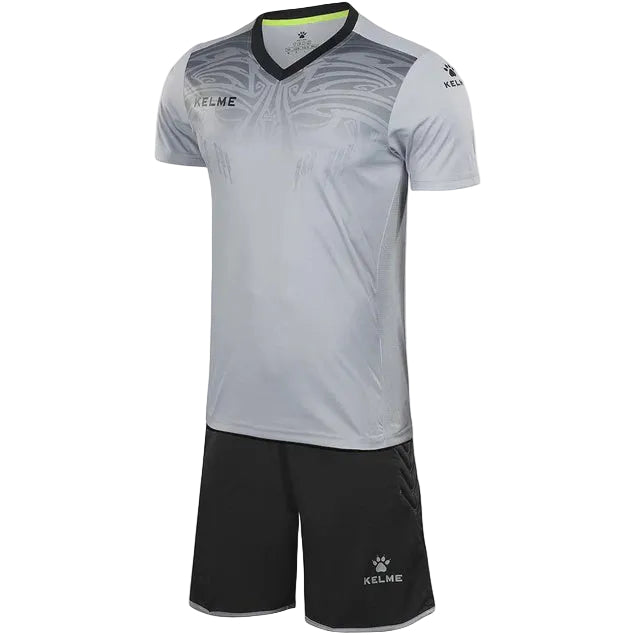 Gray sports jersey and black shorts set with 'KELME' branding on a white background