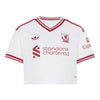 A white short-sleeve soccer jersey with red stripes and logos, featuring the Liverpool club crest, Adidas logo, and Standard Chartered sponsor logo.