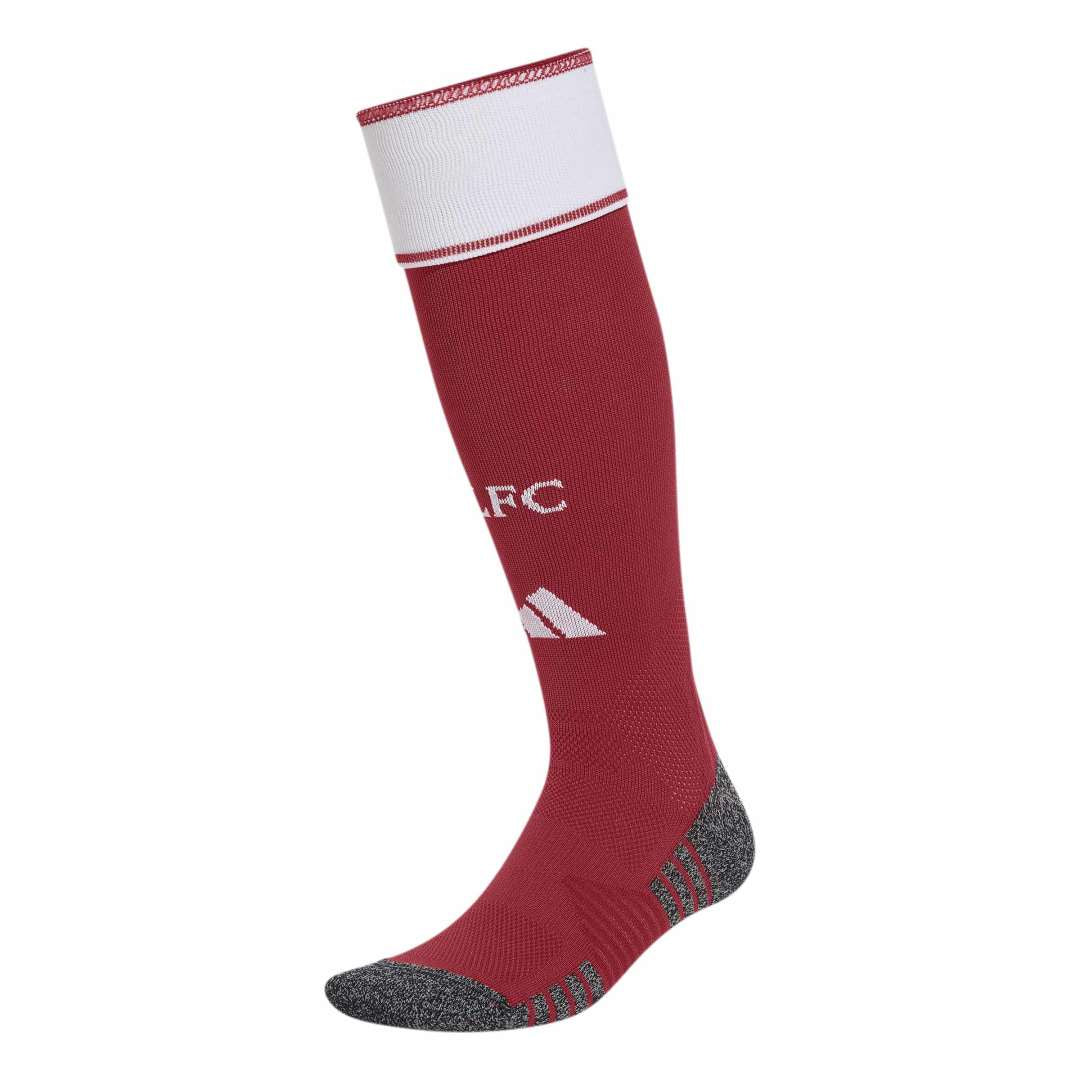 Red soccer sock with white top and black sole on a white background