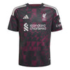 A short-sleeve soccer jersey with a black and dark magenta geometric pattern, featuring the Liverpool F.C.