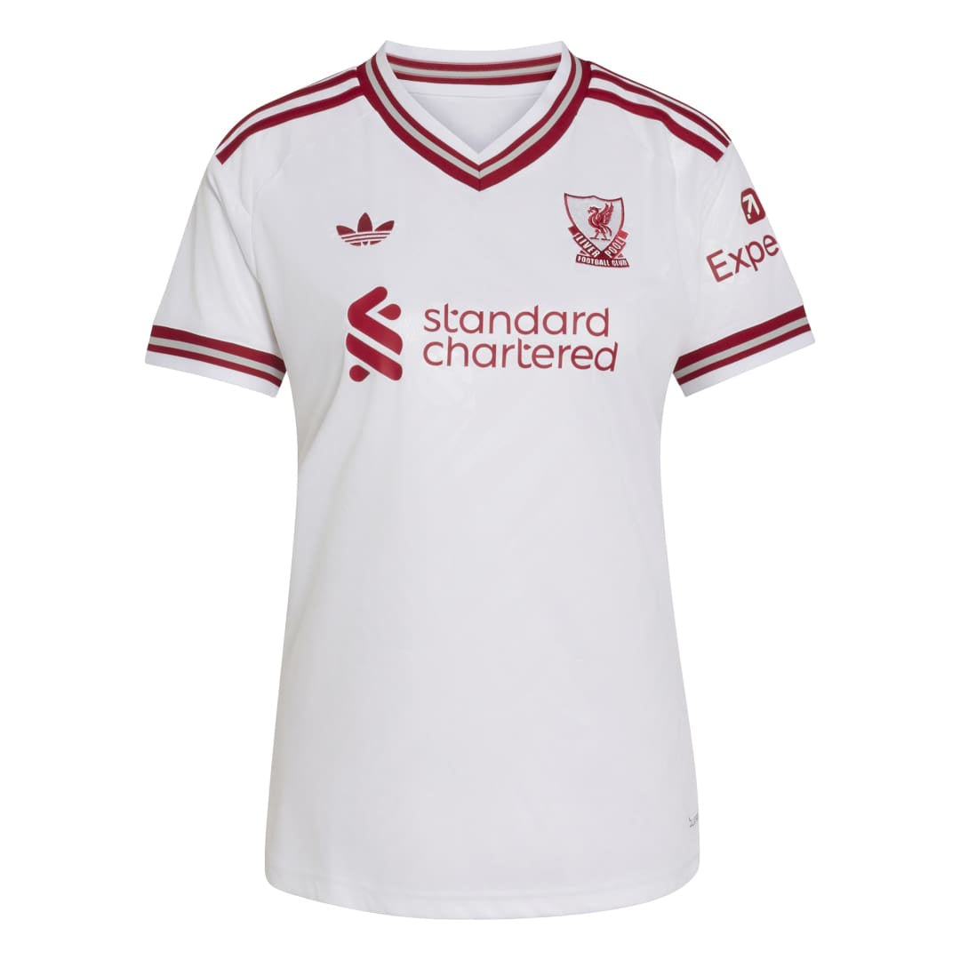 White Adidas Liverpool football jersey with red trim, featuring the Liverpool club crest, standard chartered sponsor logo, and Adidas trefoil logo.