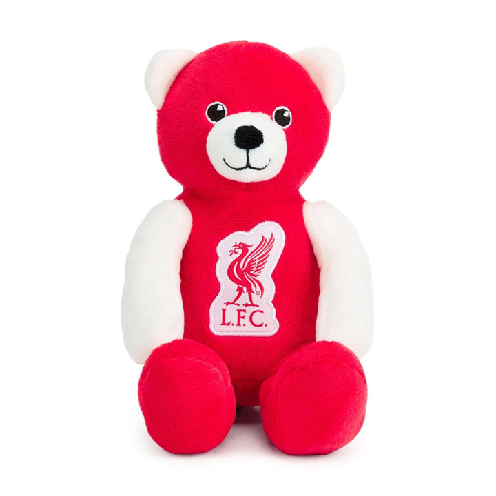 A red and white plush teddy bear with the Liverpool F.C. crest on its chest, set against a plain white background.
