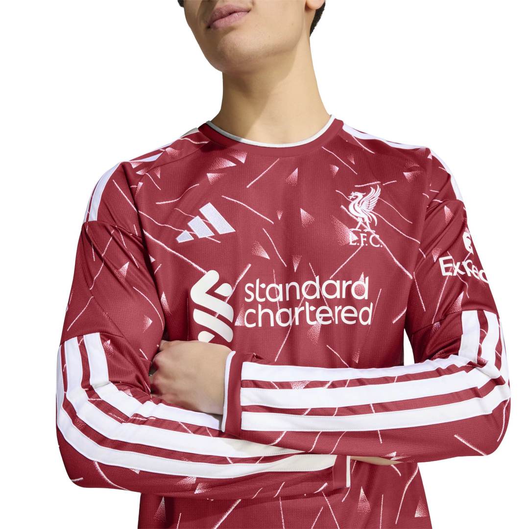 Person wearing the Liverpool FC Home Jersey Long Sleeve with arms folded