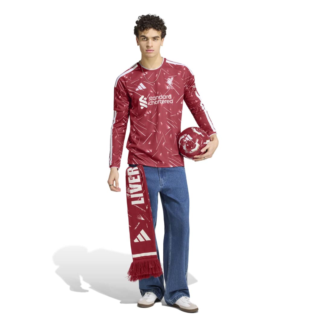 Liverpool FC Home Jersey Long Sleeve on person holding ball and wearing scarf