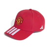 Red cap with Manchester United logo and Adidas stripes on a white background