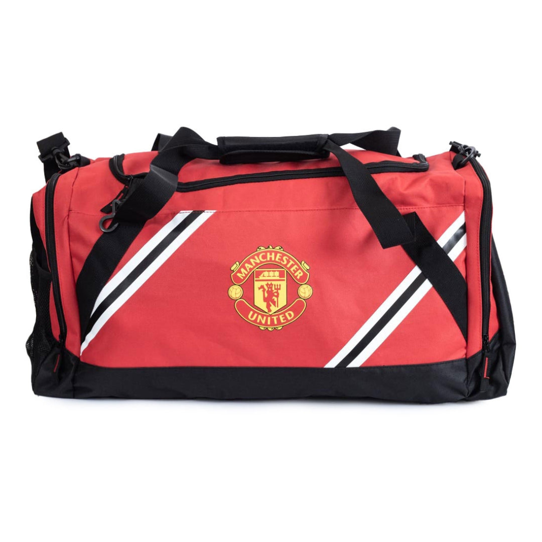 Red duffel bag with Manchester United logo on a white background