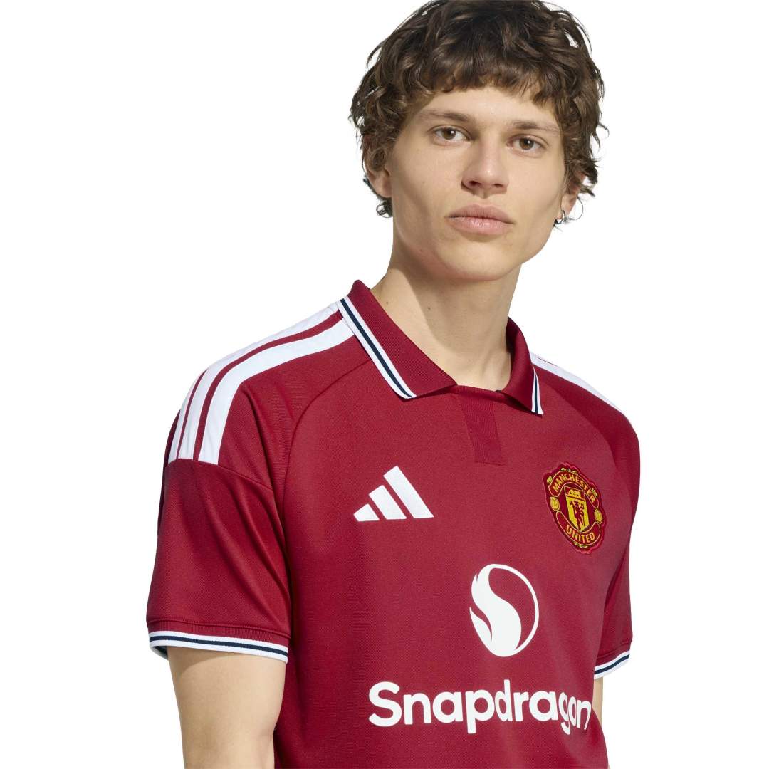 Person wearing Manchester United Home Jersey