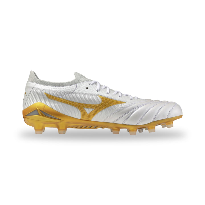 A white and gold soccer cleat shown in a side profile view against a clean white background.