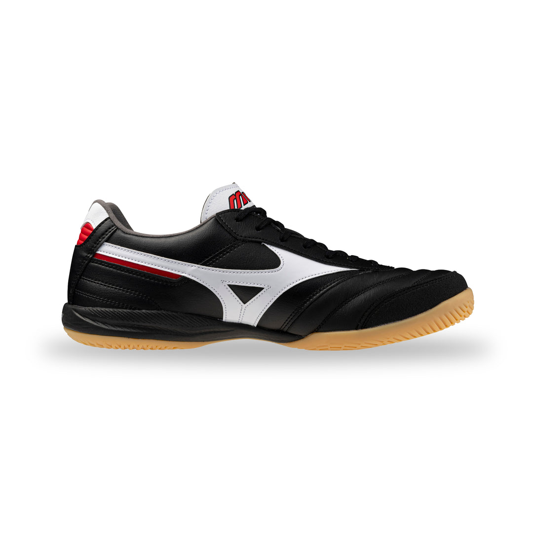 Black sneaker with white sole on a white background