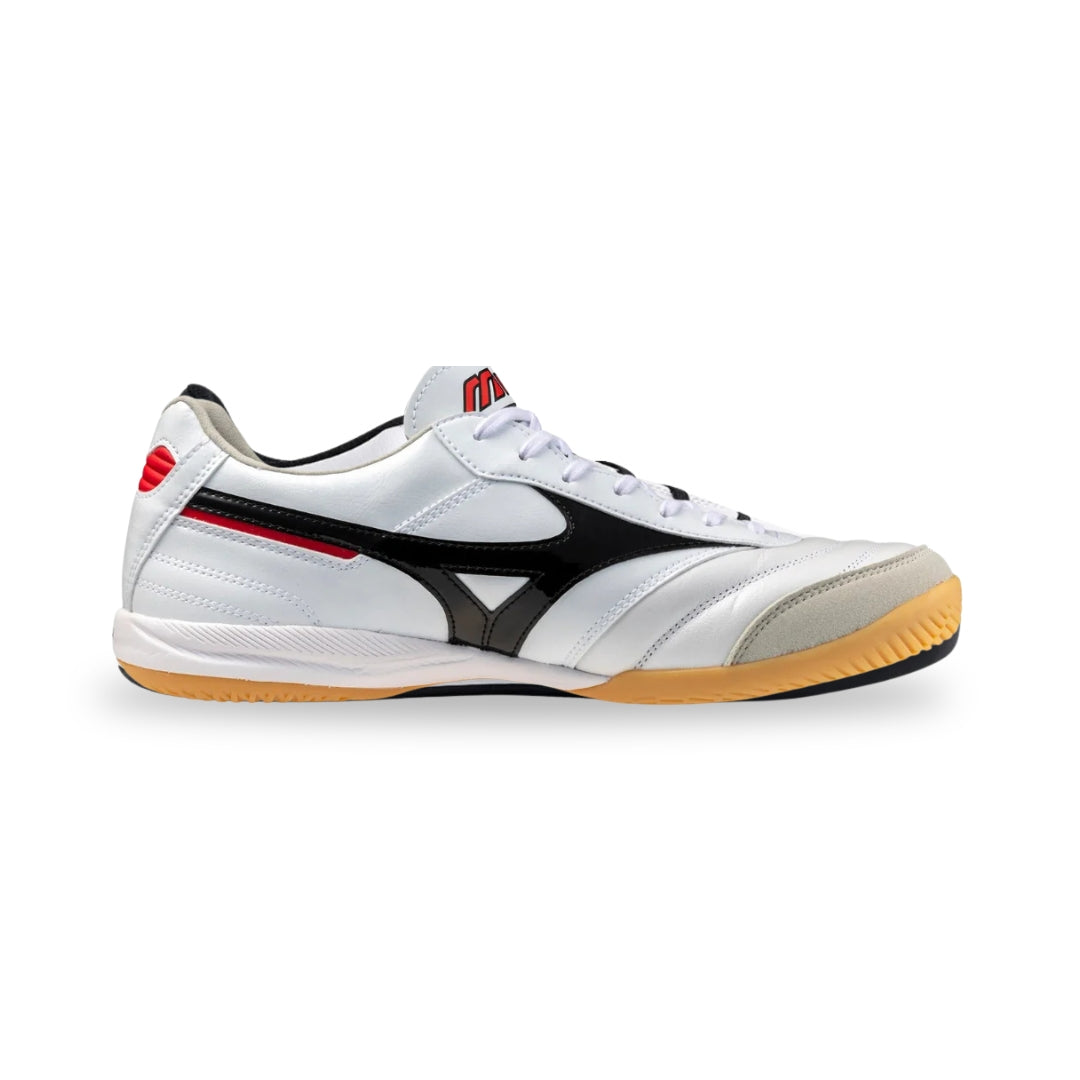 White sports shoe with black and red accents on a white background