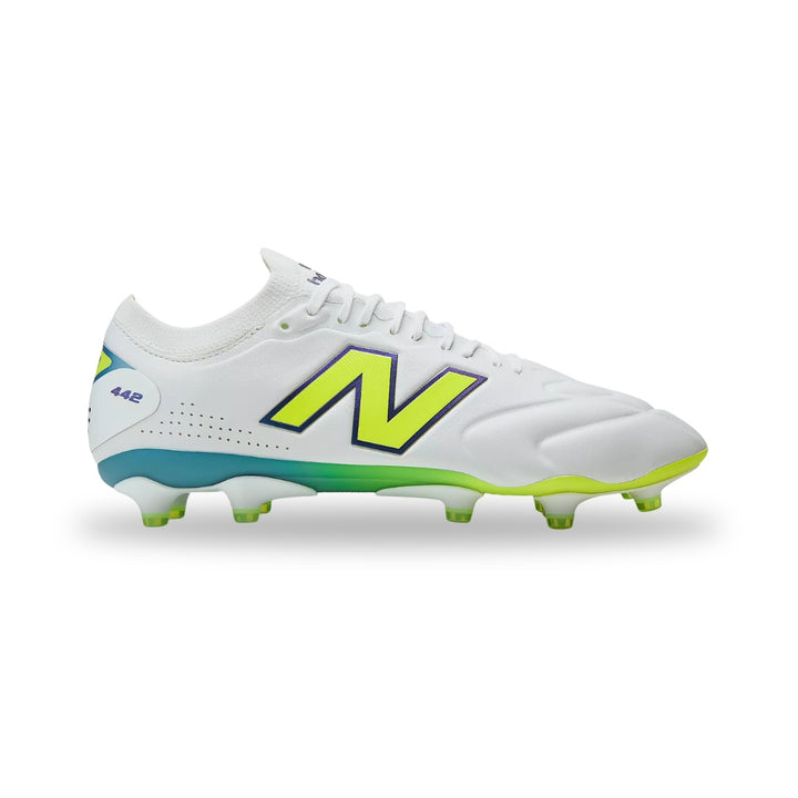 White soccer cleat with green accents on a white background