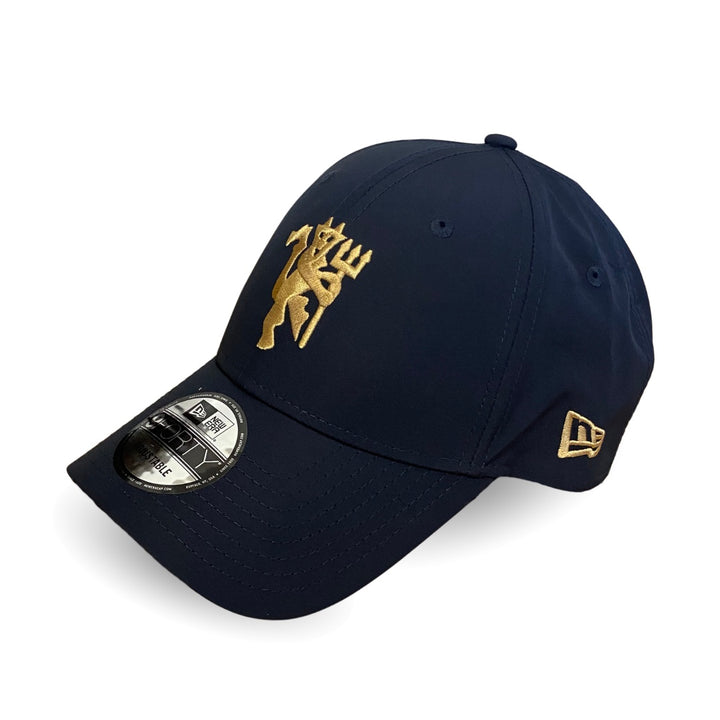 Navy blue cap with gold logo on a white background