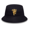 Black bucket hat with gold embroidered design on a white background