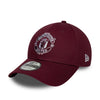 Maroon Manchester United cap with logo on a white background