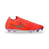 A Nike soccer cleat in a vibrant neon orange-red, featuring a metallic silver Swoosh on the side and translucent multicolor studs on a white background.