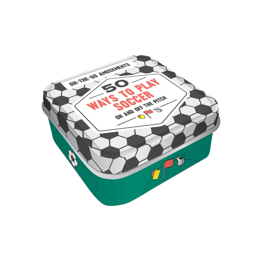 A square tin-shaped book or game box with a soccer theme, featuring a black and white soccer ball pattern lid and a teal green base. The lid has a white label that reads '50 WAYS TO PLAY SOCCER' in red text.