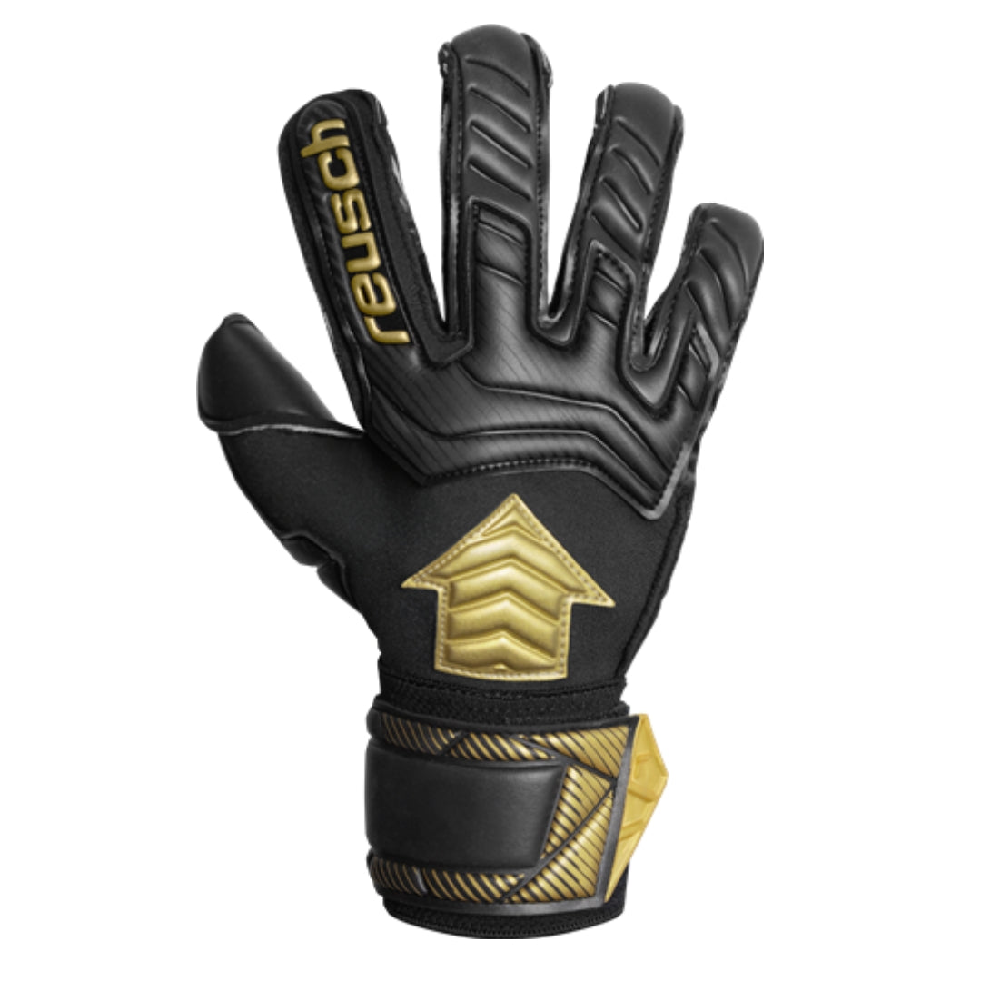 Black and gold glove with Reusch branding on a white background