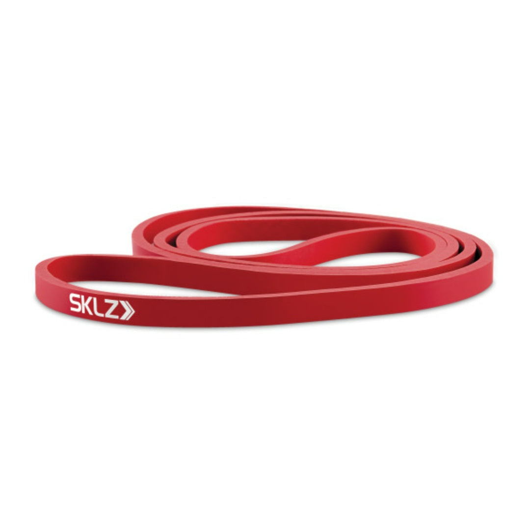 Red resistance band with SKLZ logo on a white background
