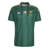 Green sports jersey with Adidas logo on a white background